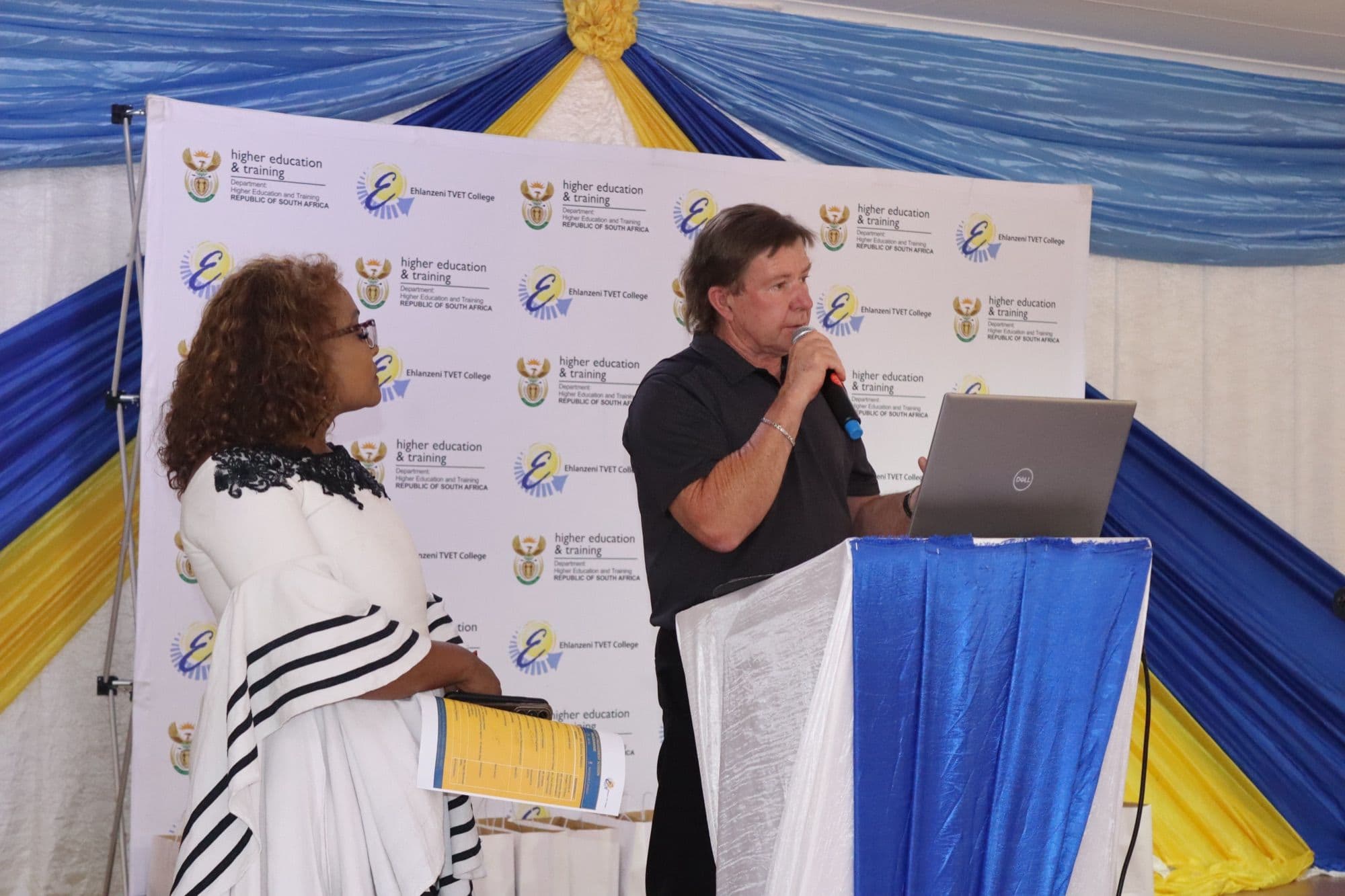 A presenter addressing stakeholders at the engagement meeting