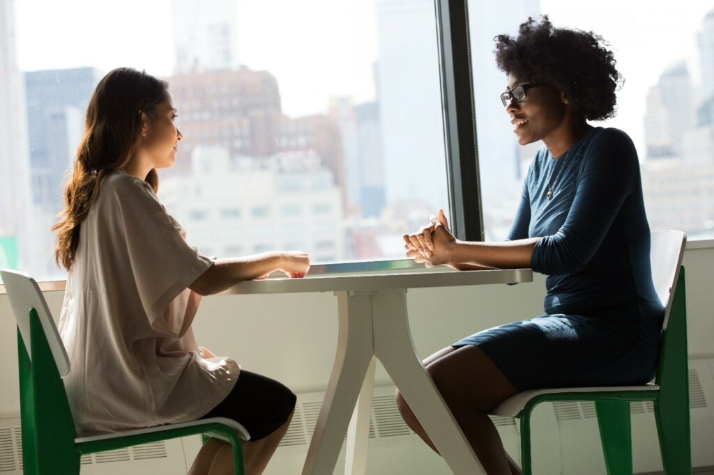 A picture of two ladies having a discussion